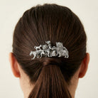 Silver tone Cat Clique Hair Barrette on a person's hair against a plain background