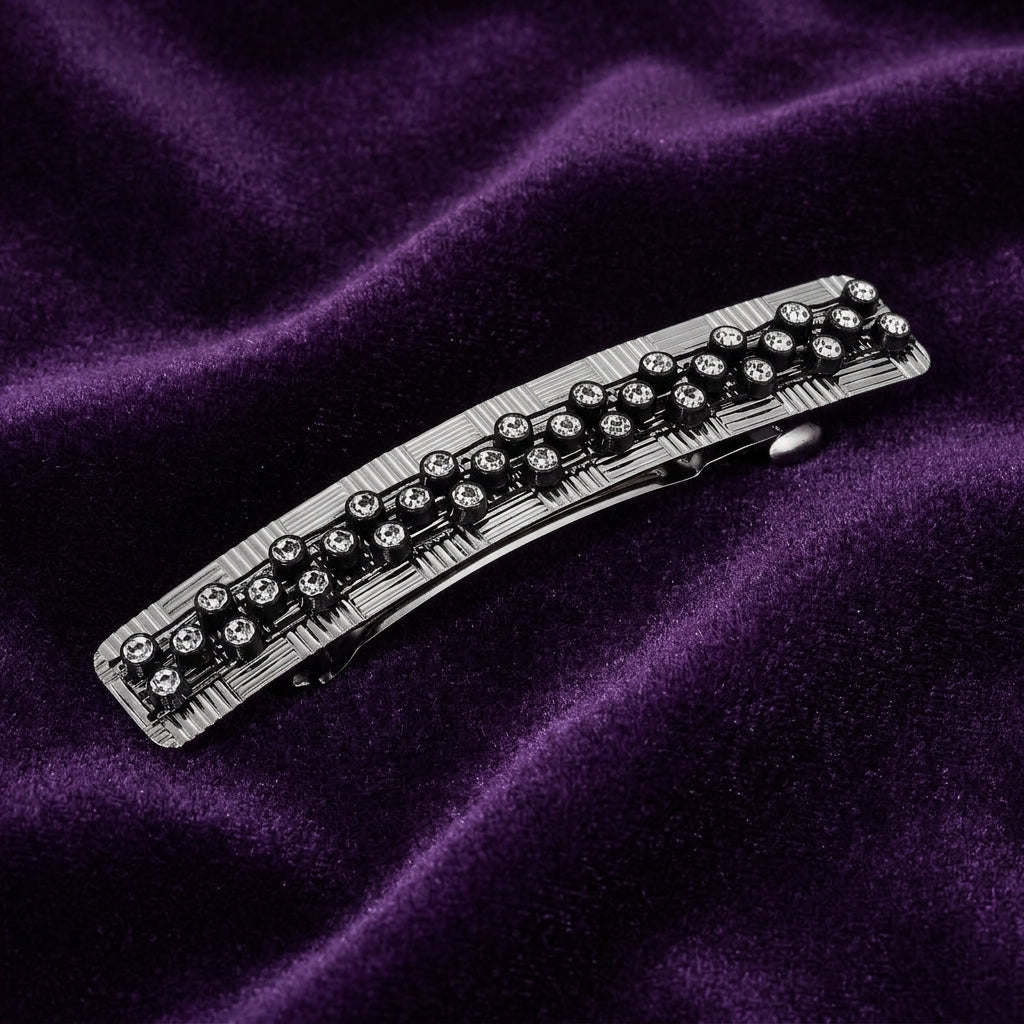 Dual Grid Multi Crystal Hair Barrette on a purple fabric background