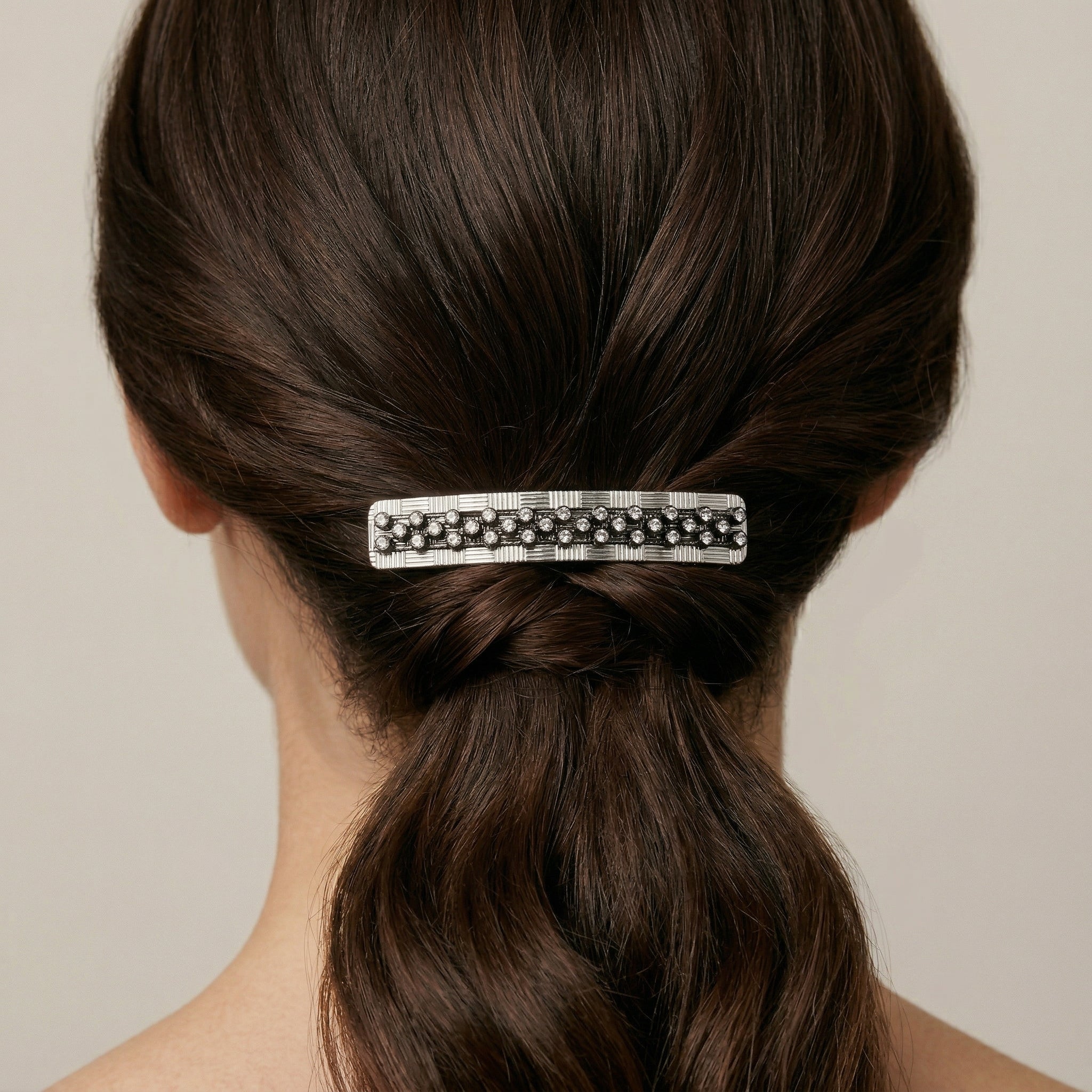 Dual Grid Multi Crystal Hair Barrette worn by a woman with dark hair