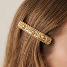 Rose Garden Hair Barrette on a person's hair against a neutral background