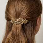 Gold tone Rock Rose Hair Barrette worn by a woman with dirty blonde hair