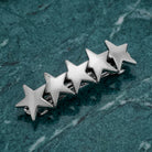 5 Star Polished Silver Hair Barrette on a textured green surface