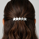 5 Star Polished Silver Hair Barrette on a person's hair against a neutral background
