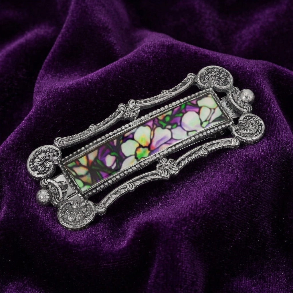Multicolor Floral Antiqued Hair Barrette on a purple fabric background