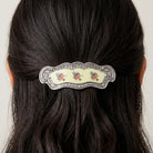 Blue And Pink Floral Hair Barrette on dark hair against a white background