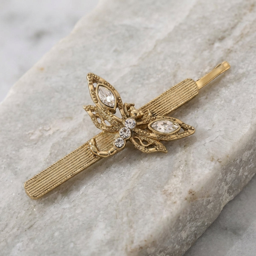 Crystal Dragonfly Bobby Pin on a marble surface