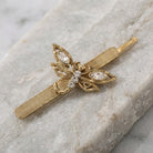 Crystal Dragonfly Bobby Pin on a marble surface