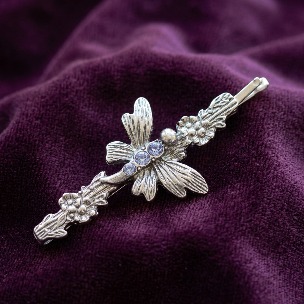 Light Sapphire Blue Crystal Butterfly Flower Bobby Pin on purple fabric 