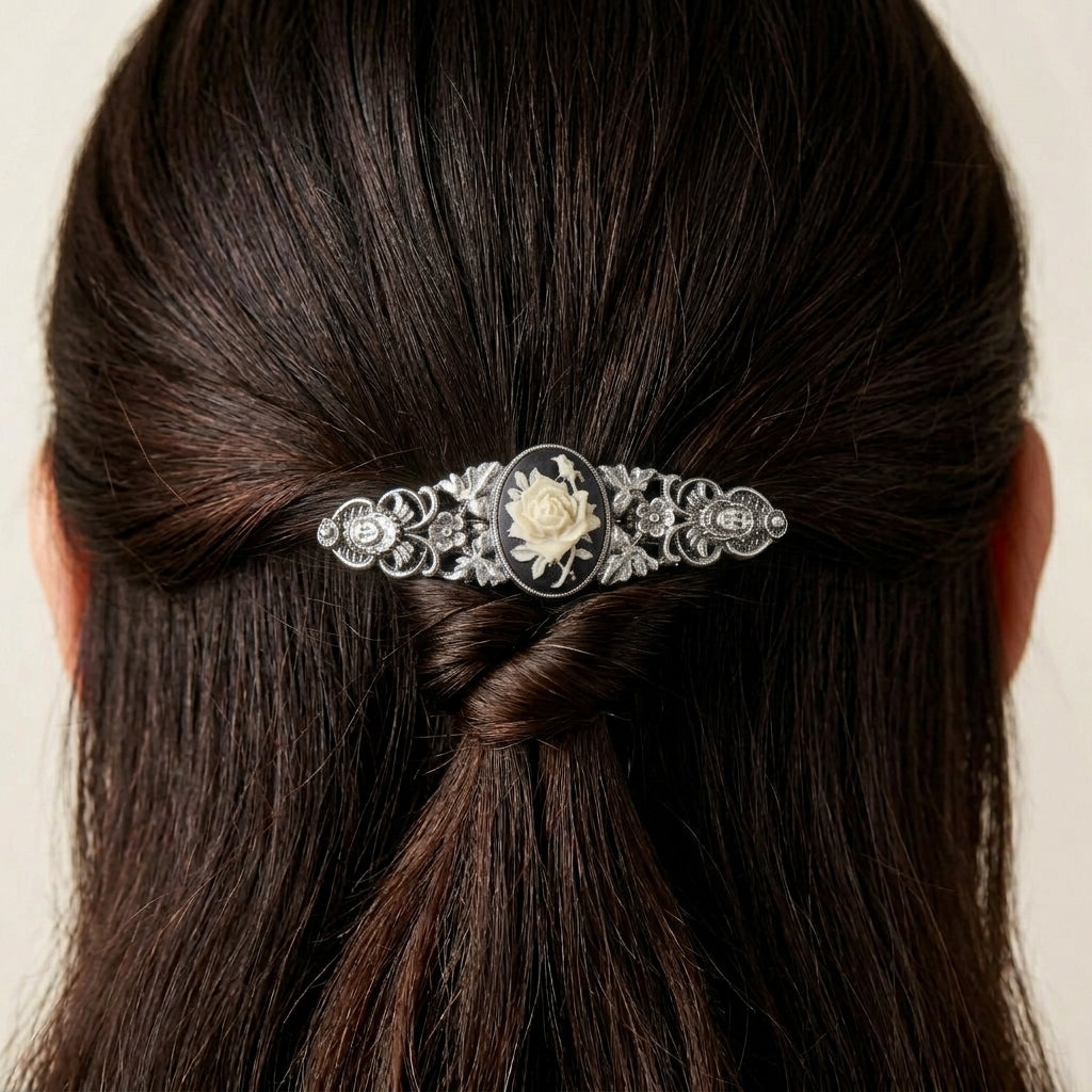 Silver tone Crowned Princess Floral Cameo Hair Barrette in a person's braided hair against a neutral background