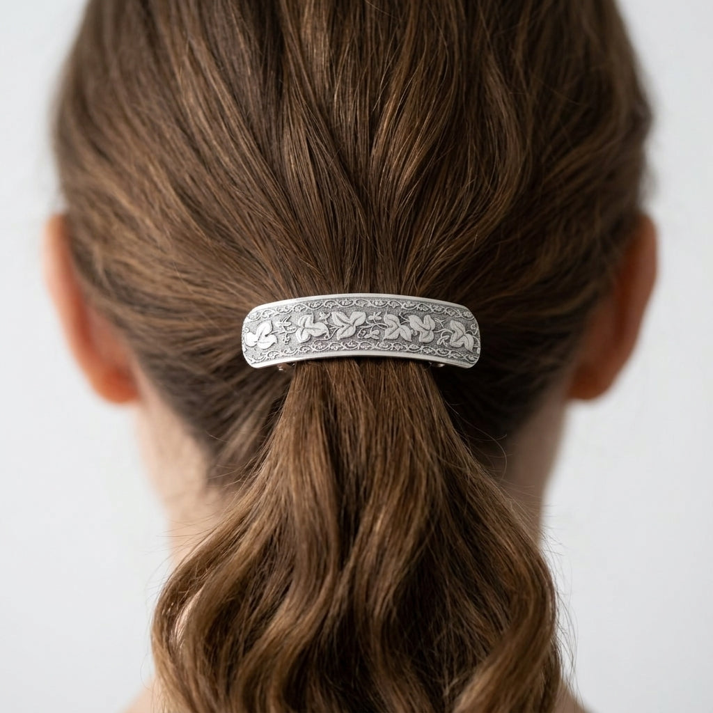 Woman wearing a silver floral design barrette