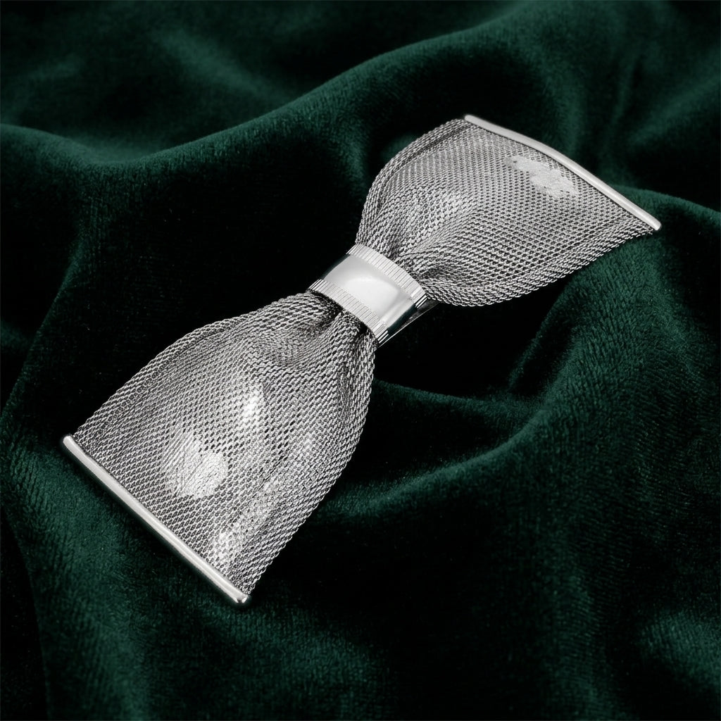 Silver Tone Mesh Bow Hair Barrette on dark green fabric
