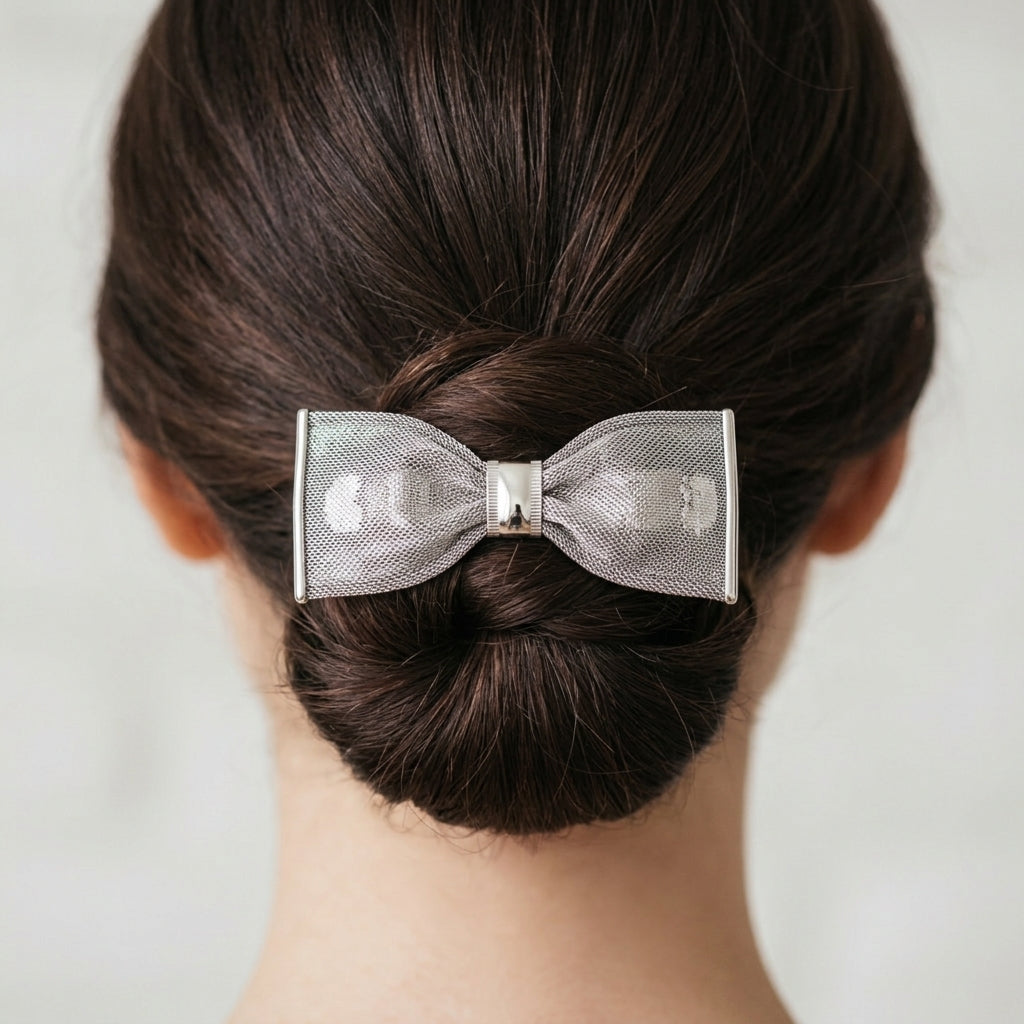 Silver Tone Mesh Bow Hair Barrette on a woman's hair bun