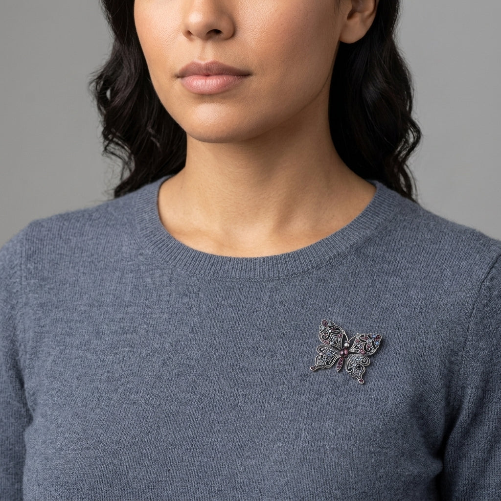 Woman wearing a blue sweater with a Antiqued Butterfly Multi Color Crystals Brooch