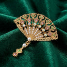 Deco Blooming Elegance Multi Crystal & Faux Pearl Brooch on green fabric