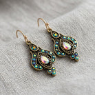 Iridescent AB Crystal & Blue Stone Teardrop Earrings on gray linen