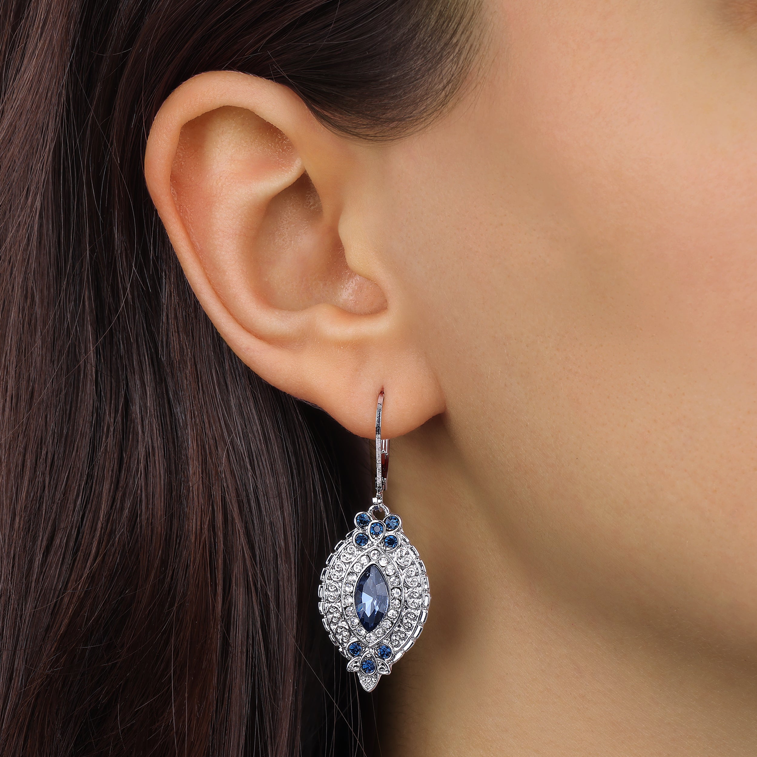 Close up of a woman wearing Montana Blue Navette & Clustered Crystal Drop Earrings