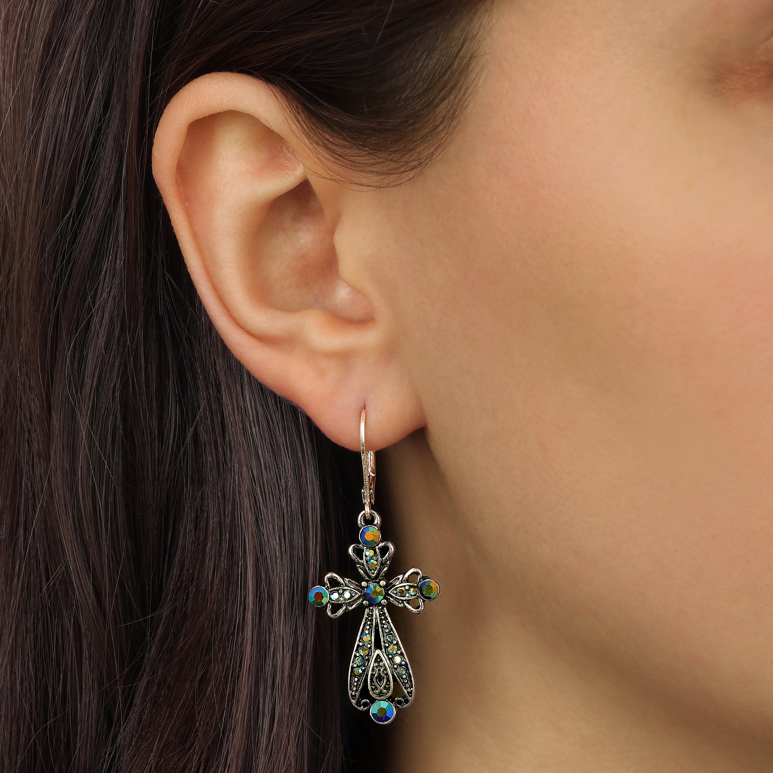 Model wearing our Gold Iridescent AB Crystal & Blue Stone Filigree Cross Leverback Earrings