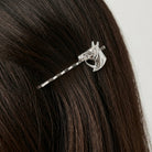 Close up of a woman's dark hair wearing a silver tone Horse Hair Jewelry Bobby Pin