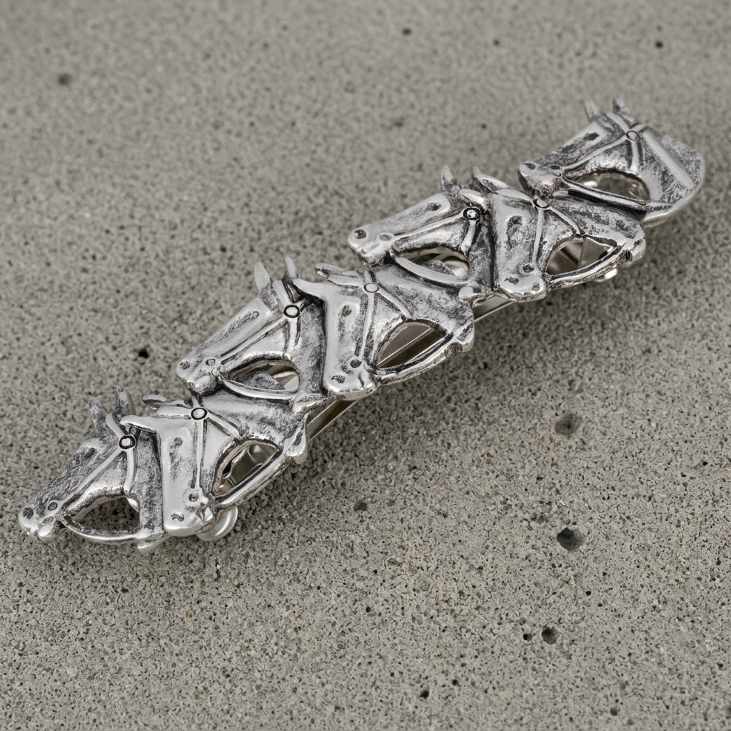 Silver tone Racing Horses Antiqued Hair Barrette on a sandy surface