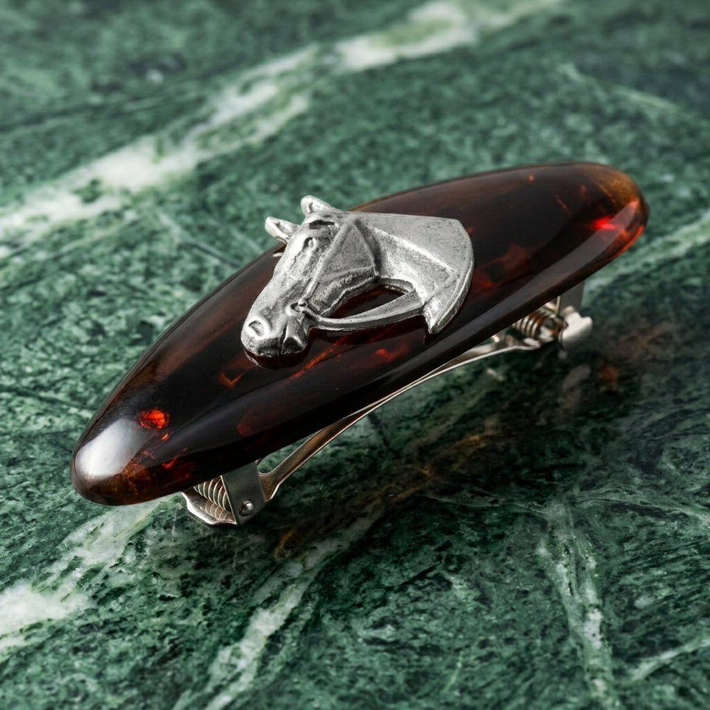 Brown Tortoise Horse Head Hair Barrette on a green marble background