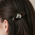 Brown Tortoise Horse Head Hair Barrette on a person's hair