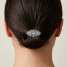 Filigree Austrian Oval Crystal Hair Clip Barrette in a person's hair against a neutral background