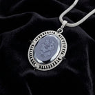 Black Intaglio Floral Stone Black & Clear Crystal Pendant Necklace on a black fabric background