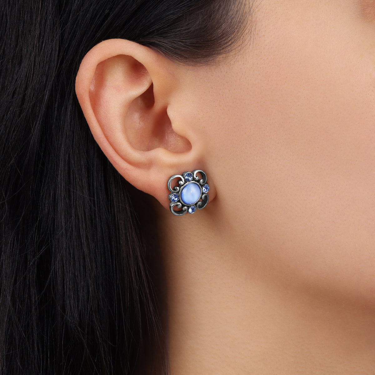 Woman wearing our Light Blue Moonstone And Light Sapphire Austrian Crystals Post Button Earrings