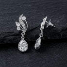 Antiquities Couture Austrian Crystal Vine Teardrop Earrings on a black stone surface