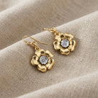 Two Tone Crystal Flower Drop Earrings on beige linen