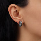 A close-up of a person's ear wearing a Silver Classic Corrugated Post Earrings