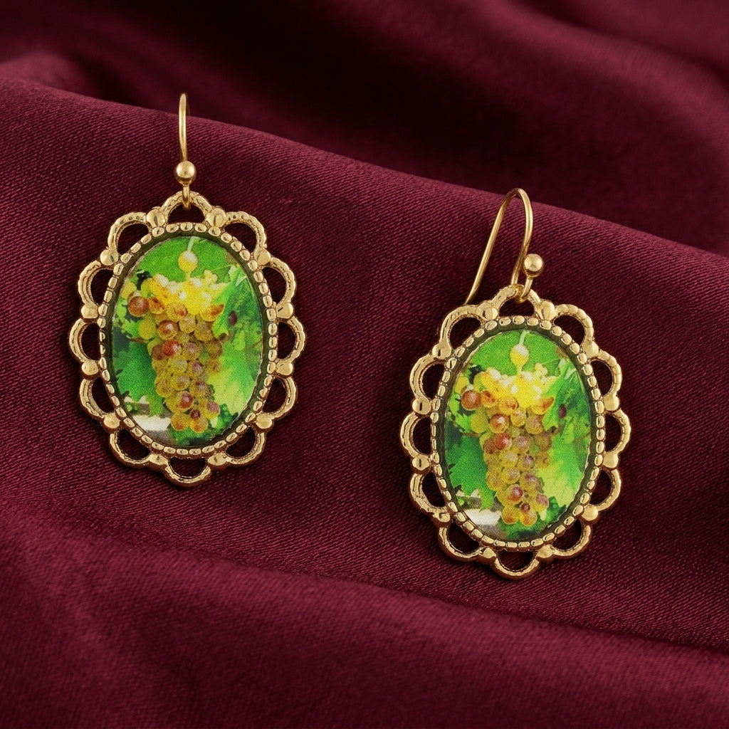 Winery Yellow Grapes Decal Oval Drop Earrings displayed on a draped burgundy fabric background.