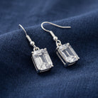 Octagon Austrian Crystals Drop Earrings on navy blue linen