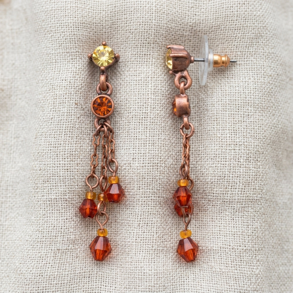 Light Colorado Topaz Tassel Earrings resting on light colored linen