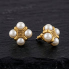 Antiquities Couture Quartet Faux Pearl Button Earrings on black stone surface