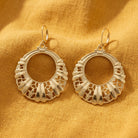 Gold Round Filigree Hoop Earrings on Marigold linen