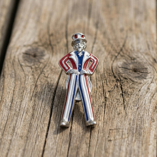 Red White And Blue Uncle Sam Pin on a wooden surface