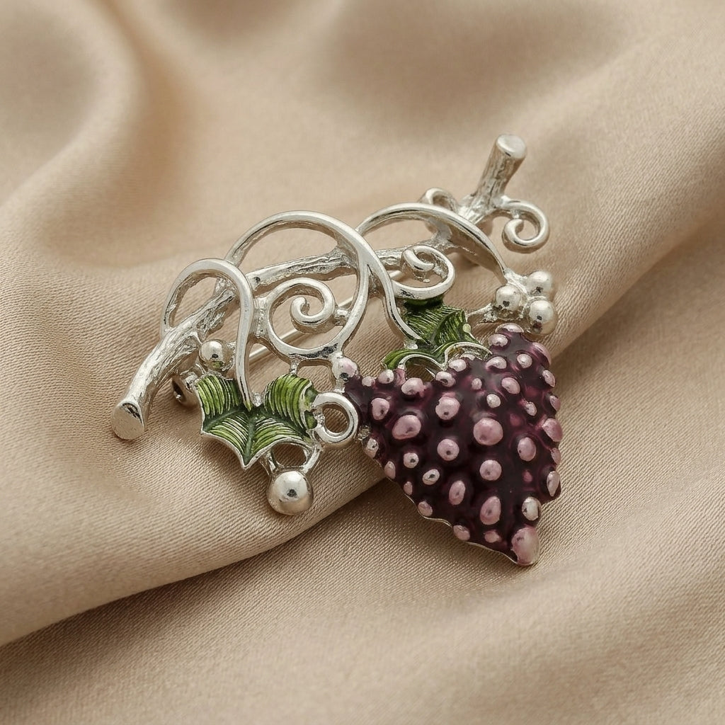 Winery Purple Grapes On Vine Pin displayed on draped beige fabric.