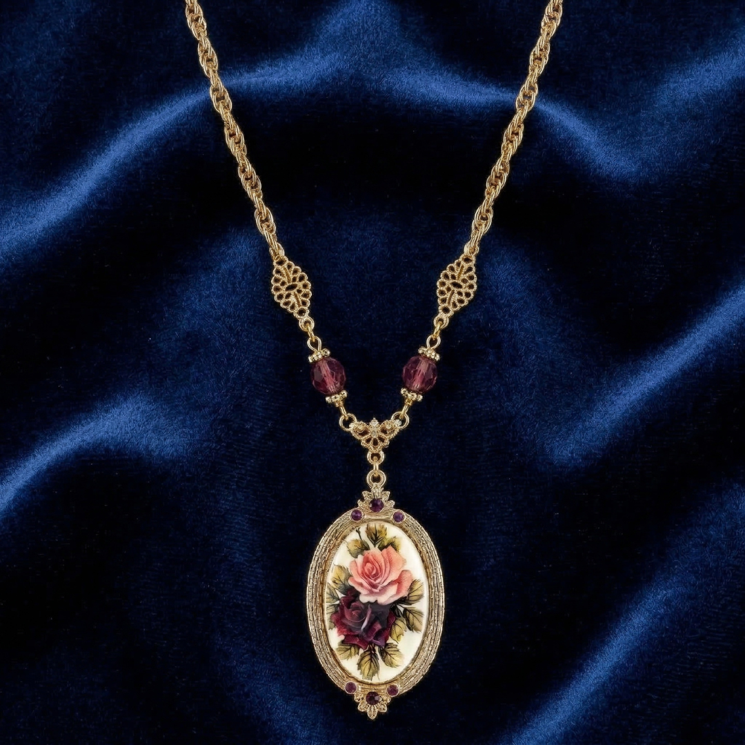 Gold necklace with a floral pendant on a blue fabric background