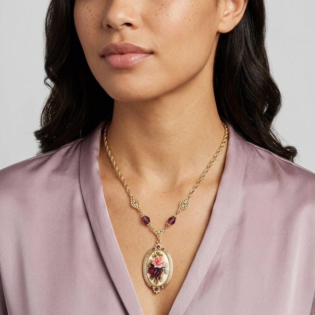 Woman wearing a gold necklace with a floral Manor House pendant against a neutral background