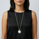 Woman wearing a black sleeveless top with a White Howlite Gemstone Pendant Necklace