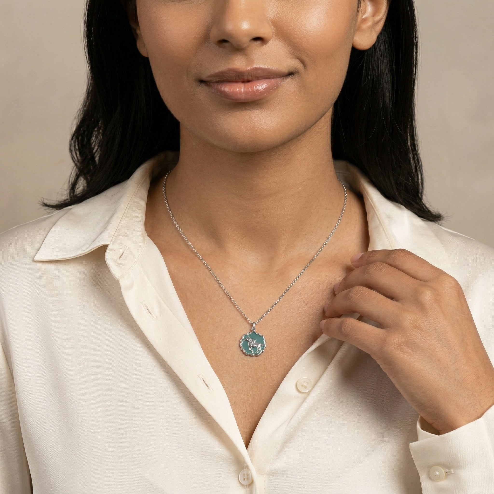 Woman in a white top wearing a Turquoise Color Enamel Horse Pendant Necklace