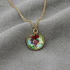 Winery Round Grapes Decal Pendant Necklace 16" + 3" Extender resting on gray linen fabric