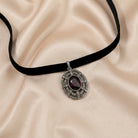 Amethyst Stone Black Velvet Choker Necklace 12" + 5" Extension resting on beige satin fabric