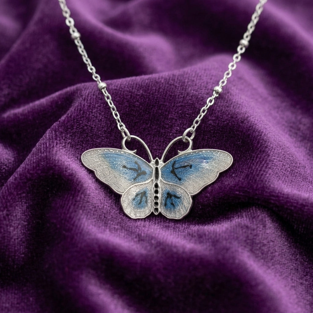 Butterfly necklace on a purple fabric background