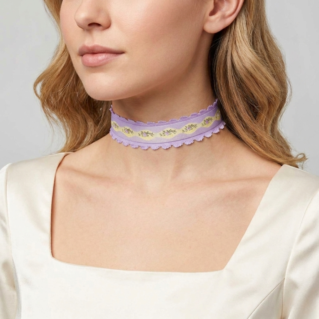 Woman wearing a delicate purple lace choker against a neutral background