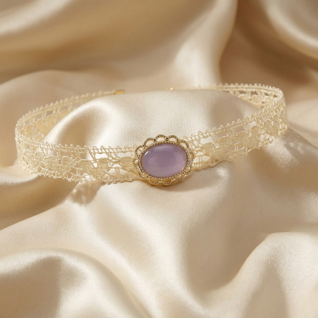 Delicate lace choker with a purple stone on a soft beige fabric background