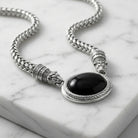 Antiquities Couture Jaguar Black Onyx Stone Symmetry Necklace on a marble surface