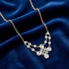 Clear Crystal Flower Necklace on a blue velvet background