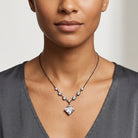 A close-up of a model wearing a Genuine Austrian Crystal Diamond Shape Pendant Necklace 16" + 3" Extender